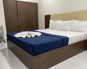 Hotel Millennium Plaza - Jamnagar - Schlafzimmer
