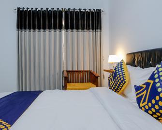OYO 1687 Griya Harmoni Syariah - Batu - Bedroom