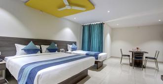 Orange Suites Airport Transit Stay - Bengaluru - Schlafzimmer