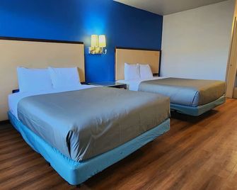 Country Yard Inn and Suite - Sikeston - Camera da letto