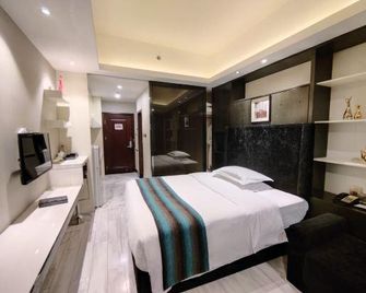 Kanglaibo Boutique Hotel Ganzhou - Ganzhou - Bedroom