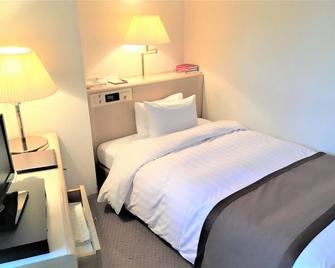 Awa Kanko Hotel - Tokushima - Schlafzimmer