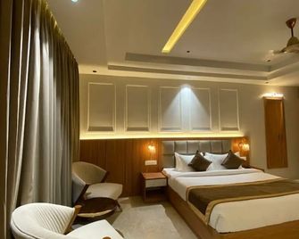 The Maasai Mara Resort, Water & Adventure Park, Corbett - Rāmnagar - Schlafzimmer