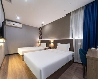 7 Days Premium Hotel (Jiangmen Xinhui Pedestrian Street Xinghui Square Store) - Jiangmen - Slaapkamer