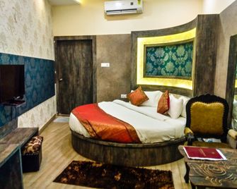 Dwivedi Hotels Sri Omkar Palace - ורנאסי - חדר שינה