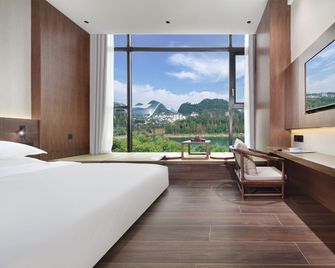 Riverside Wing Hotel Guilin - גילין - חדר שינה