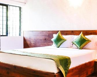 Treebo Comforts Inn, University Road Deralakatte - Ullal - Habitación