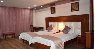 Hotel Sujata - Bodhgaya - Schlafzimmer