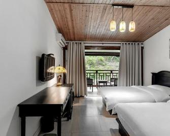 Early Impression Hotel - Huzhou - Спальня