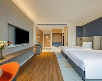 هوليداي إن إكسبرس نانينج جيانجنا بآباي آيتش جي - ناننينغ - غرفة نوم