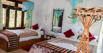 Tiger Residency Resort - Sauraha - Makuuhuone