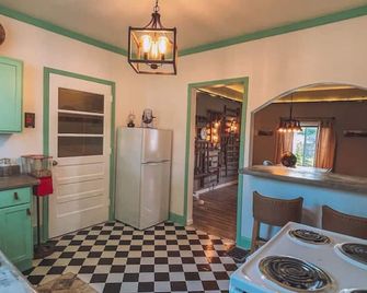 Vintage Romance Finds Cozy Charm at Depot Cottage - Dowagiac - Kitchen