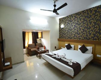 Hotel Vaishnavi - ג'איפור - חדר שינה