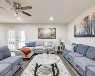 Enjoy the large backyard of the home with your own BBQ to entertain. - Flower Mound - Living room