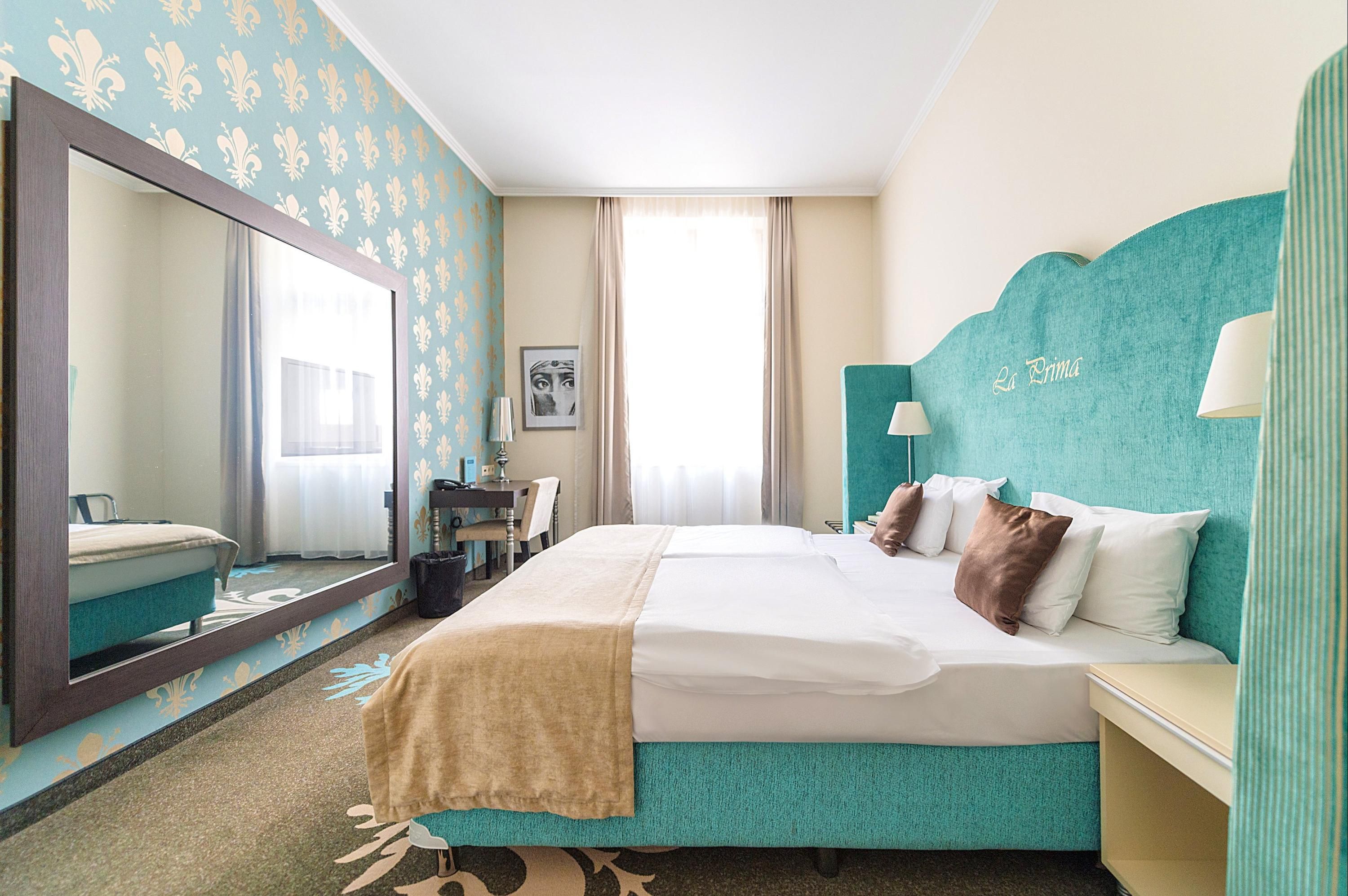 Bedroom view of La Prima Fashion Hotel