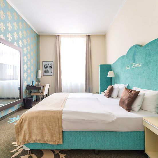 Bedroom view of La Prima Fashion Hotel