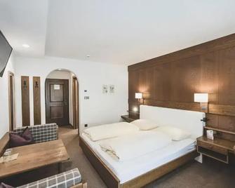 Hotel Bergland - Steinhaus - Schlafzimmer