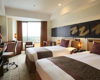 International Resort Hotel Yurakujo - Narita - Camera da letto