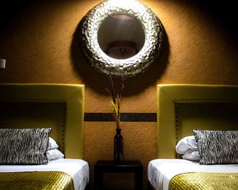 Villas y Suites Paraiso del Sur - קוארנאבאקה - חדר שינה
