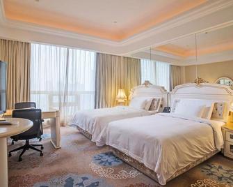 Platinum Hanjue Hotel - Вуксі - Спальня