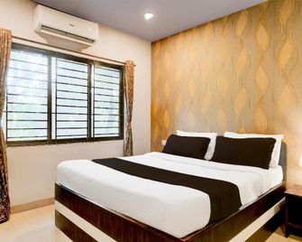 Super OYO Collection O Pratishtha - 高哈蒂 - 臥室