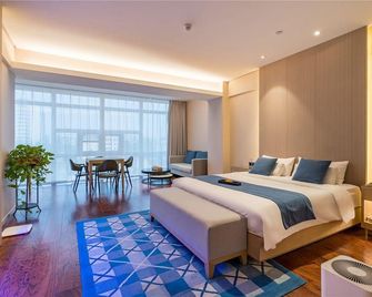 Xuzhou Yunlong Wanda Plaza Langbo Hotel - Xuzhou - Camera da letto