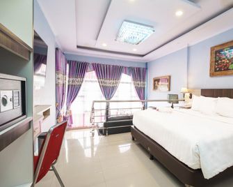 King Suite Hotel Bengkulu - Bengkulu - Schlafzimmer
