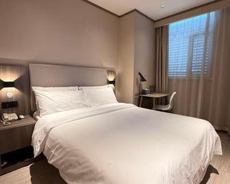 Hanting Hotel Tianjin Jinnan Development Zone National Exhibition Center - Tianjin - Bedroom