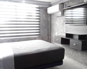 موتل آند هوتل ألجيب - هيرموسيلو - غرفة نوم