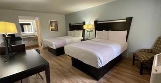 Tricove Inn & Suites - Jacksonville - Bedroom
