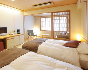 Hotel Taisetsu Onsen&Canyon Resort - Kamikawa - Schlafzimmer