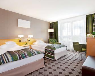 Mövenpick Hotel Nürnberg Airport - Nuremberg - Bedroom