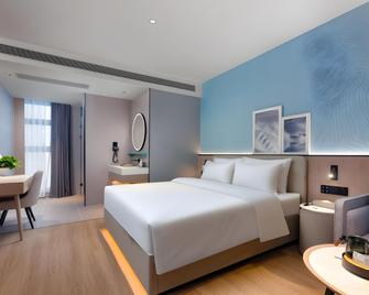 Country Inn & Suite by Radisson, Chongqing Liberation Monument Hongya Cave - Chongqing - Bedroom