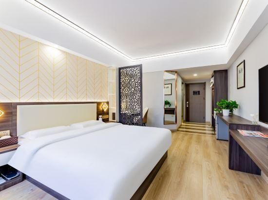 Chang An Jin Zuo Hotel - הוהוט - חדר שינה