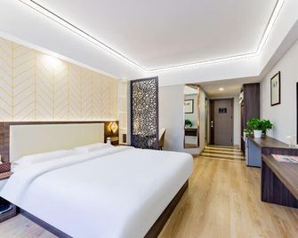 Chang An Jin Zuo Hotel - הוהוט - חדר שינה