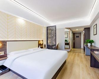 Chang An Jin Zuo Hotel - הוהוט - חדר שינה