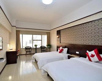 Kunming Ha Te Da Zhen Plaza Hotel - Kunming - Habitación