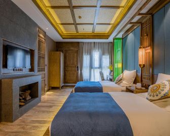 Floral Hotel Qinyuan - ליז'יאנג - חדר שינה