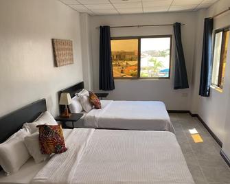 La Casa Baatsona Apts - Tema - Bedroom