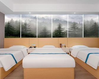 Gelingeli Hotel (Wanhua Building Branch, Cross Street Downtown, Yulin) - Yulin - Bedroom