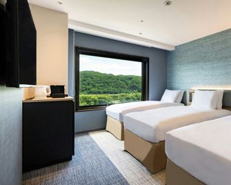 ANA Holiday Inn Iwate Kitakami by IHG - Kitakami - Bedroom