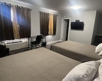Alpha Inn - Wawa - Habitación