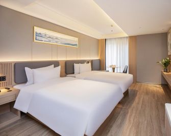 Mujiangnan Hotel (Nanjing Hexi Golden Eagle World Branch) - Nanjing - Slaapkamer
