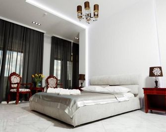 Giowine Hotel & Restaurant - Chisinau - Slaapkamer