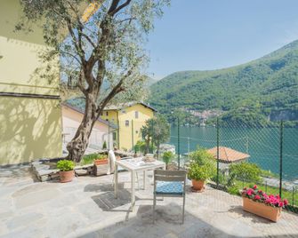 La Quiete with Private Garden by Rent All Como - Laglio - Patio