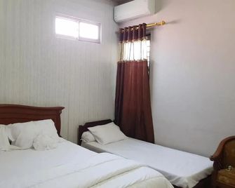 Homestay Lotus Bangka Pangkal Pinang Redpartner - Пангкалпінанг - Спальня