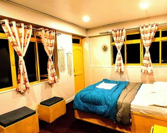 Hidden Monkey Backpackers, Darjeeling - דאריילינג - חדר שינה