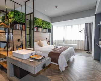 Guofa Hualian Hotel - Beihai - Schlafzimmer