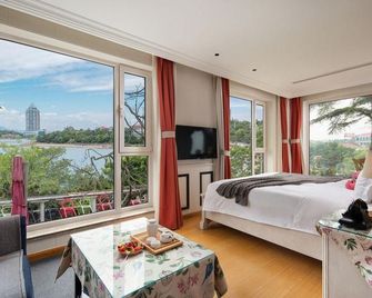 Imeroui Seascape Villa Hotel (Qingdao Badaguan Scenic Spot) - Qingdao - Schlafzimmer