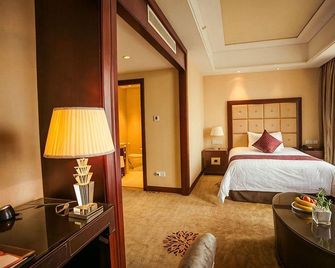 Manju Hotel - Xinxiang - Schlafzimmer